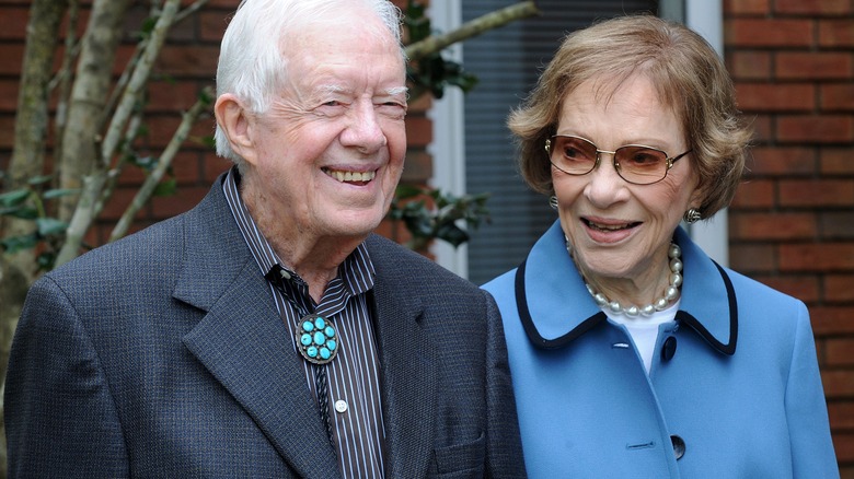 Rosalynn and Jimmy Carter outside smliing