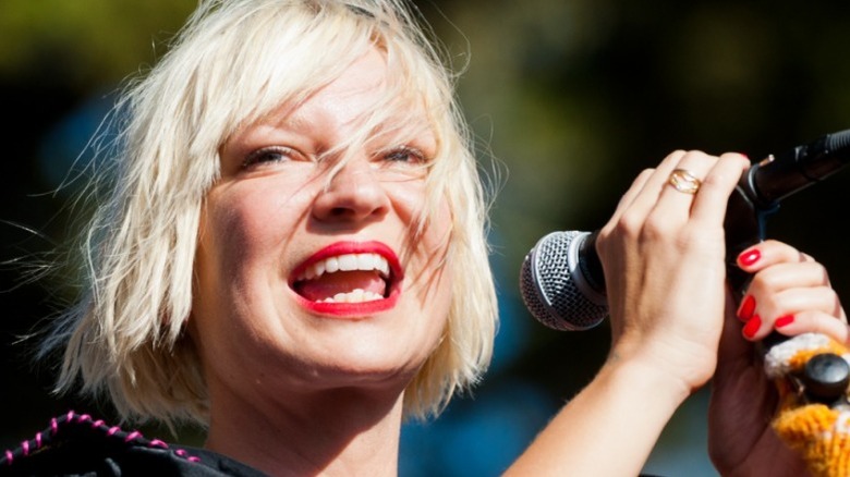 Sia smiling while performing