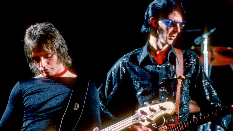 Ben Orr and Ric Ocasek performing on stage