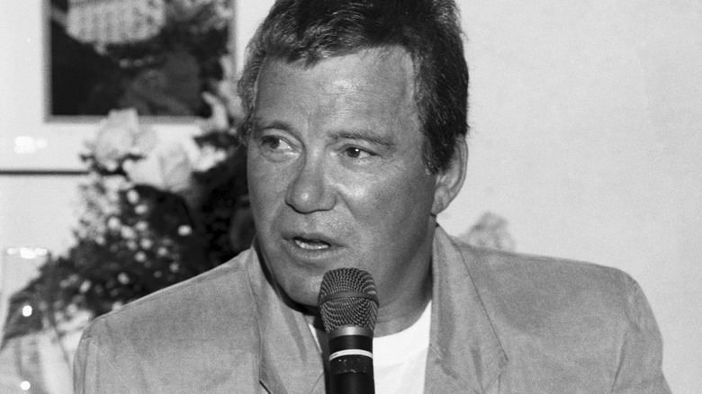 William Shatner speaking into microphone