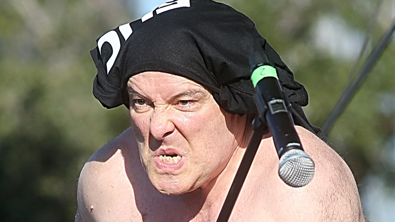 Jello Biafra performing shirt on head