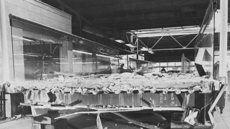 A sideview of the collapsed walkway in black and white