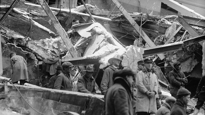 Wrecked interior of the Knickerbocker Theatre and responders