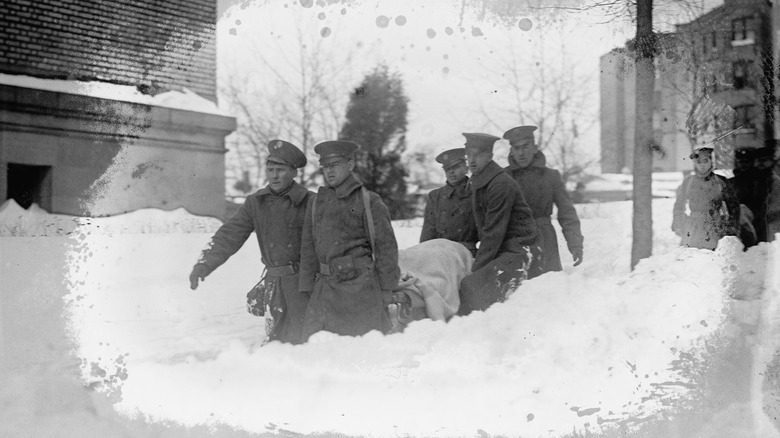 Men carrying a victim of the Knickerbocker Theater on a stretcher