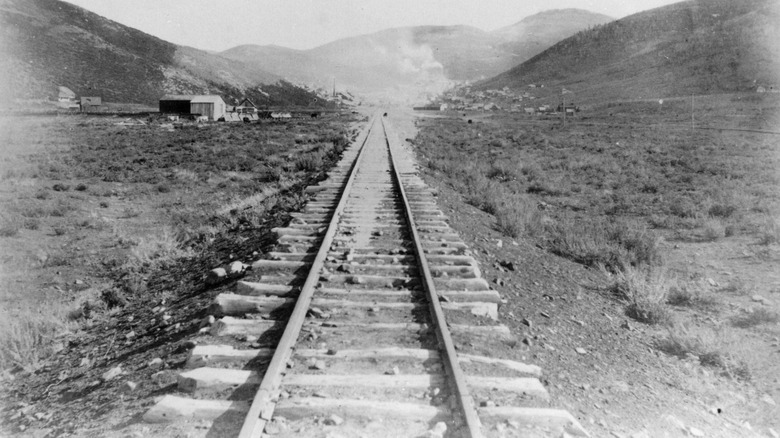 Railroad tracks in desert canyon