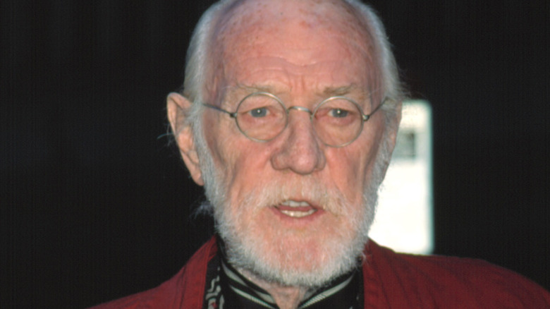 Richard Harris mouth open with glasses