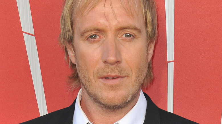 Rhys Ifans wearing a suit