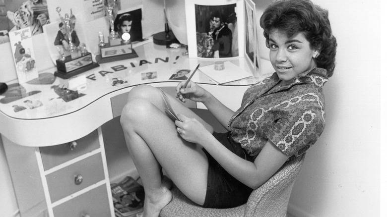 annette funicello writing at her desk