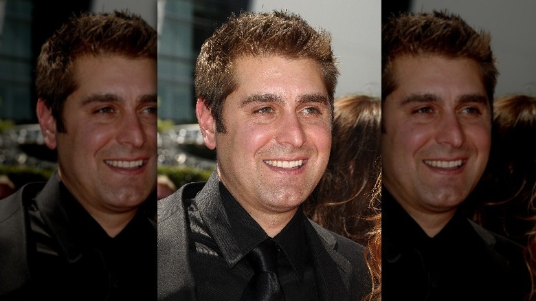 tory belleci smiling in black suit