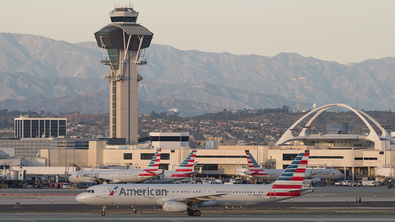 LAX control tower and planes sitting on tarmac