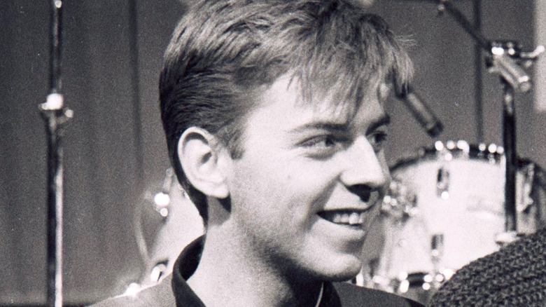 Andy Rourke smiling