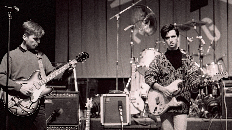 Andy Rourke and Johnny Marr onstage