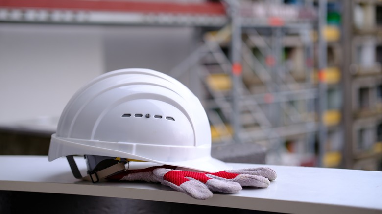 Hat and gloves at construction site