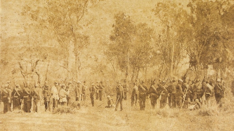 brazilian soldiers in front of trees sepia