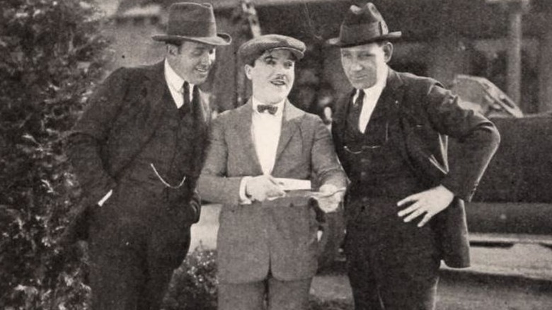 Jack Warner, Monty Banks, and Sam Warner posing