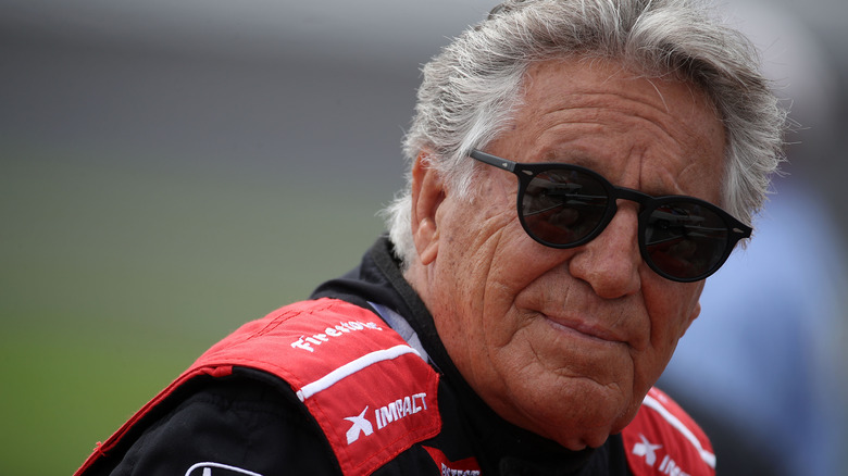 Mario Andretti wearing sunglasses