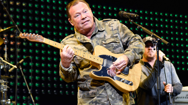 ali campbell performing on stage with ub40