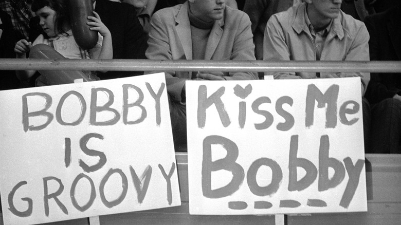 supporters' signs during a campaign rally for RFK