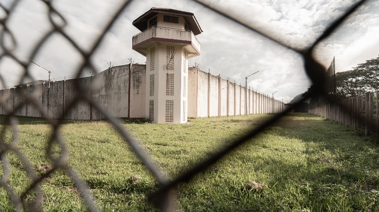 Prison behind barbed wire fence