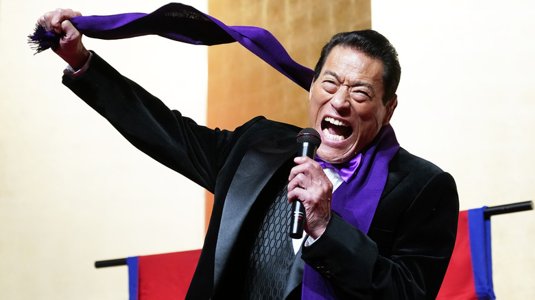 Antonio Inoki holding a scarf