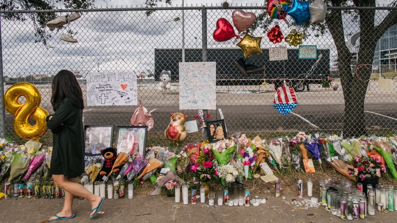 Flowers, balloons, candles at memorial