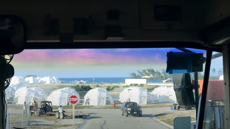 Bus approaching Fyre Festival tents