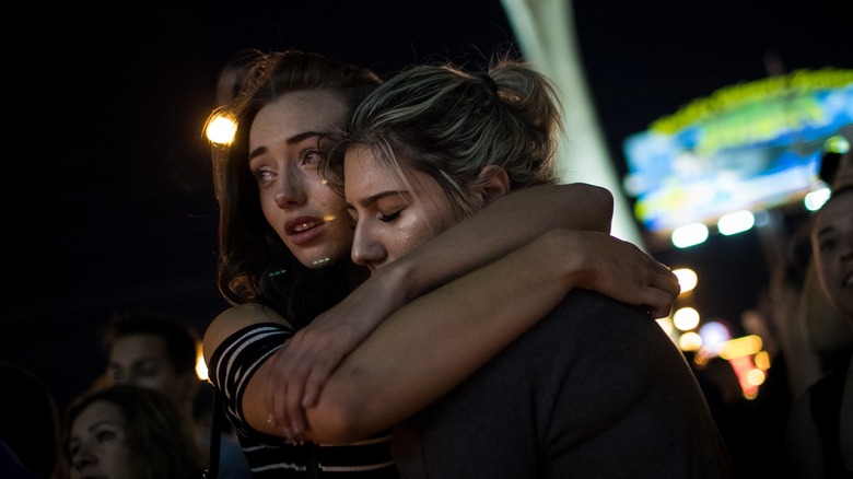 Two women hugging and crying