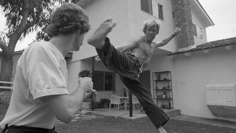 young Chuck Norris mid-air kick