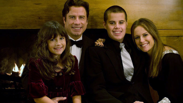 John Travolta Kelly Preston posing with children