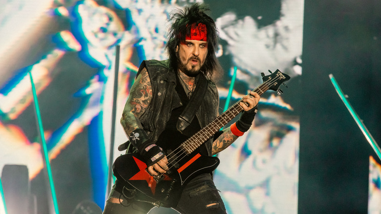 Nikki Sixx playing bass