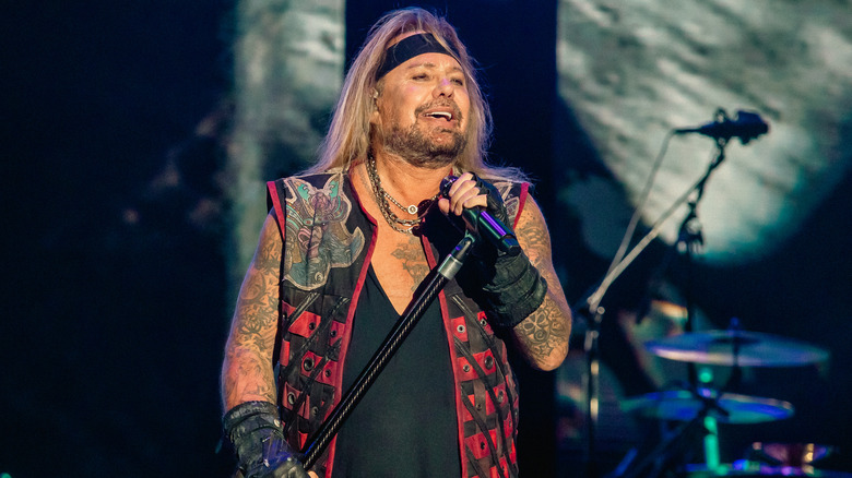 Vince Neil singing into microphone