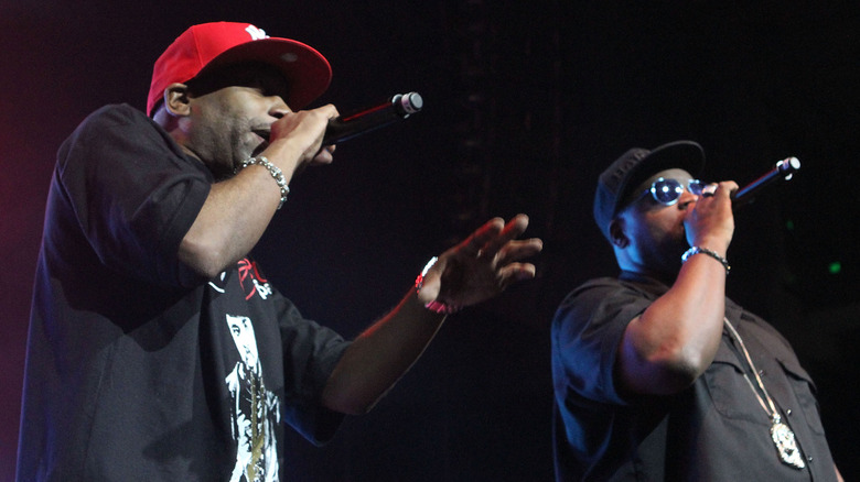 Rob Base and DJ E-Z Rock black shirts performing on stage