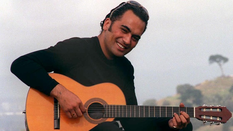 Pauly Fuemena OMC guitar smiling