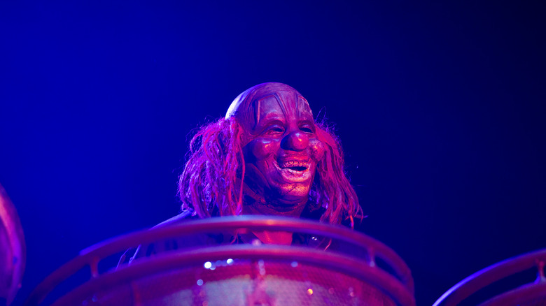 Illuminated Crahan clown mask on stage