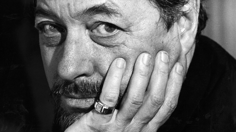 Tennessee Williams rests face on hand