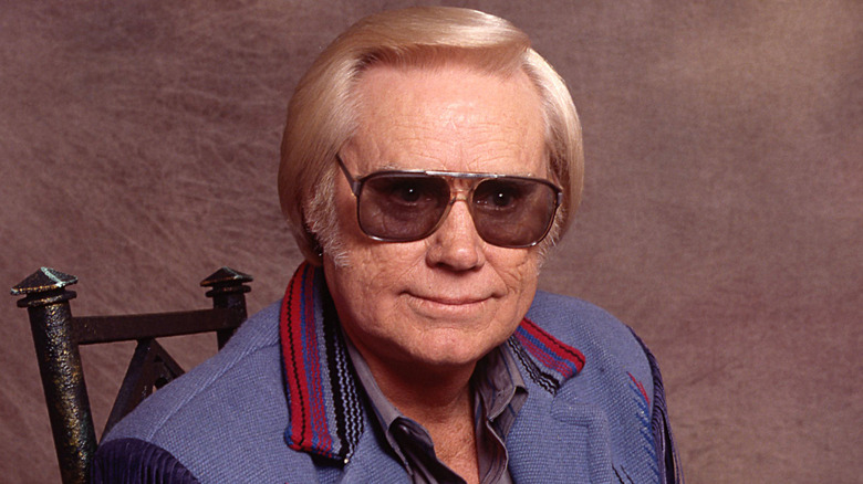 george jones in dark glasses staring away