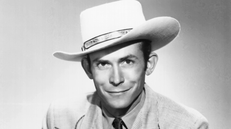 hank williams smirking with askew cowboy hat