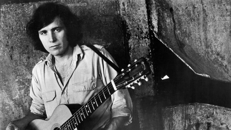 Don McLean posing with his guitar