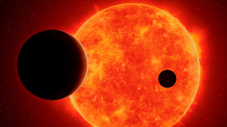 Exoplanets passing in front of a red dwarf star.