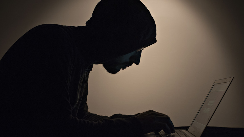 Man typing on computer