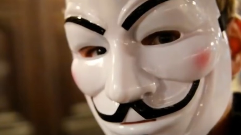 Person wearing anonymous mask