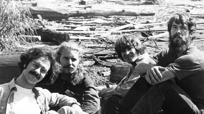 Creedence Clearwater Revival sitting on tires