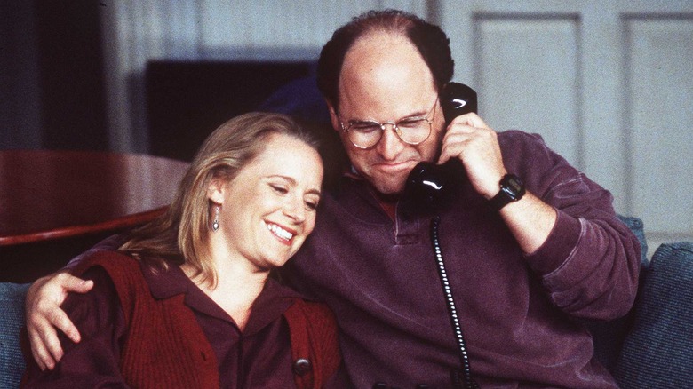 George Constanza holding phone hugging Susan Ross