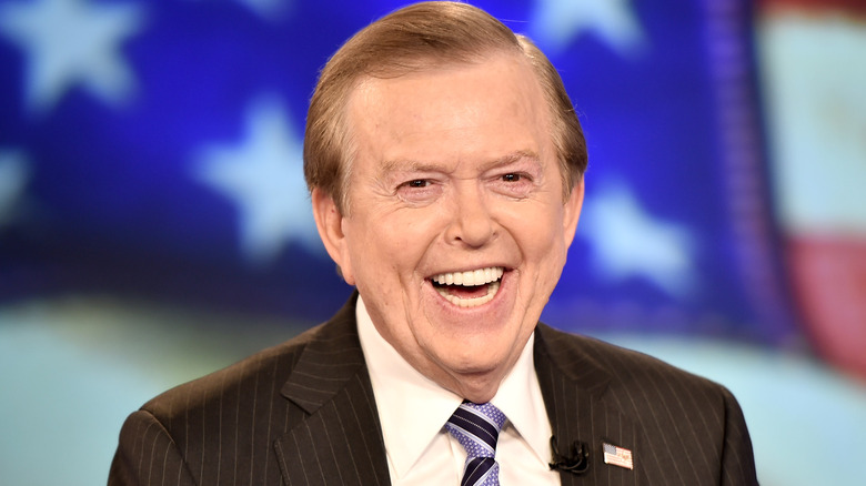 lou dobbs laughing suit U.S. flag