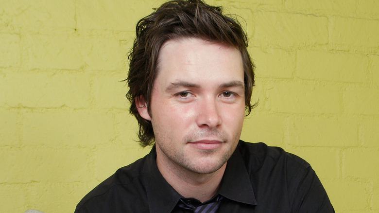 Michael Johns posing for press photo