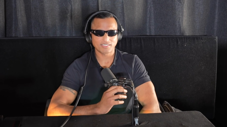 Peter adiwal in glasses headphones with microphone