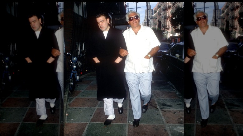 Fr. Louis Gigante white shirt walking with brother NY street