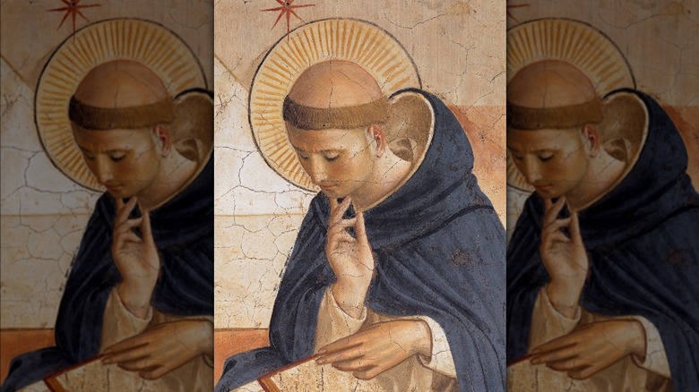 Painting of St. Dominic with halo and tonsured hair reading