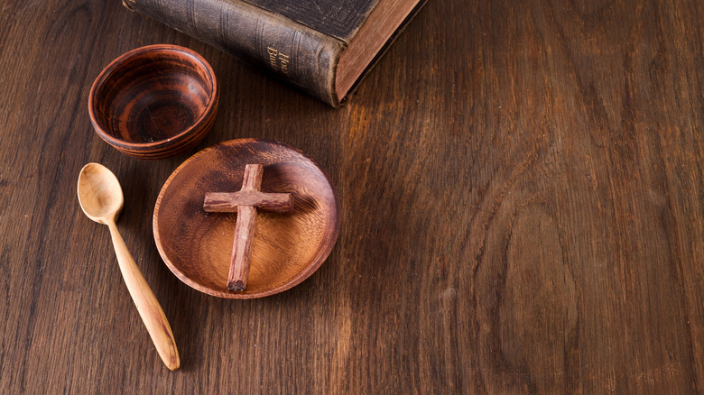 plain cross bowl and bible on table