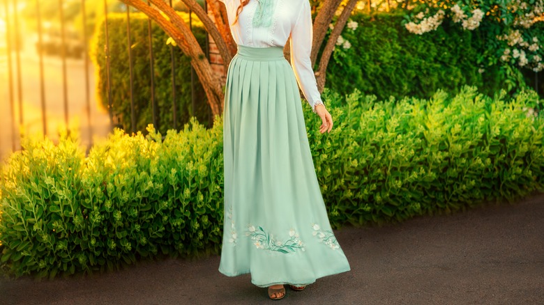 Girl wearing long skirt and blouse